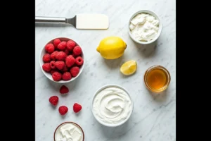 Ingredients for making raspberry lemon fruit dip on a countertop.