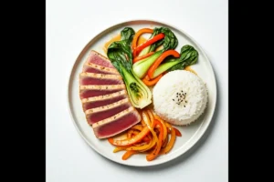 Plated seared ahi tuna with rice and vegetables